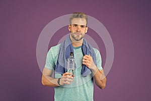 Man athletic hold water bottle. Handsome athlete drink water. Water balance. Sport for better life. Thirsty man. Athlete