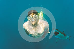 Man is attacked by a shark under water.  Diving sports, risk and danger and panic attack victim concept