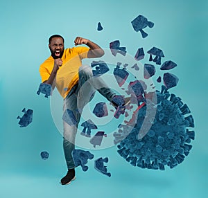 Man attacks with a kick the coronavirus. Blue background