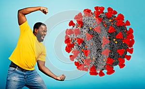 Man attacks with a punch the coronavirus. Blue background