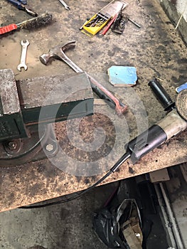 Man auto mechanic working in a garage, workshop