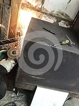 Man auto mechanic working in a garage, workshop