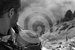 Man with baby on the mountain