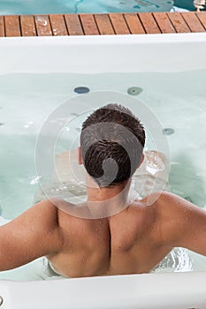 Man back inside a jacuzzi