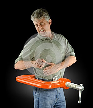 Man back pain injury feels like vise clamp on lower back muscles