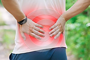 Man with back pain, kidney inflammation, trauma during workout