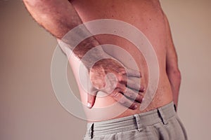 Man with back pain. People, health care, medicine concept