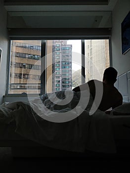 Man back shot on bed naked on morning in Hong Kong