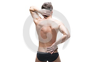 Man with backache. Pain in the human body. Muscular male body. Isolated on white background