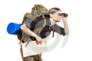 Man backpacker with map looking through binoculars