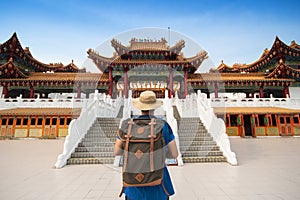 Man backpacker tourist is visiting Thean Hou Temple in Kuala Lumpur