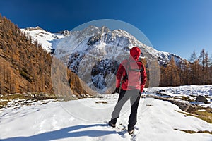 Man is backpacking in winter mountains. Piemonte, Italian Alps, photo