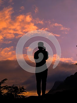 Man backside silhouette with beautiful sky background during sunset photo