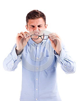Man with bad vision hold glasses