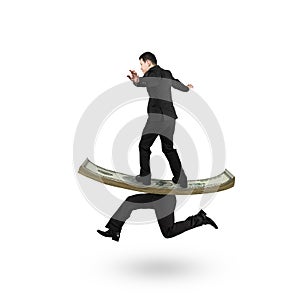 Man balancing on running money with legs