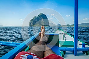 Man in banca, Inabuyatan island ahead, El, Nido, Palawan, Philippines