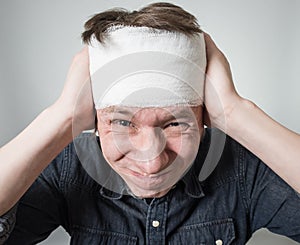 Man with bandage on his head