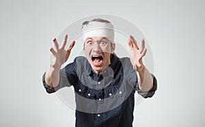 Man with bandage on his head