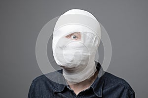 Man with bandage on his head