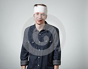 Man with bandage on his head