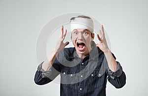 Man with bandage on his head