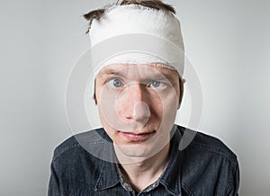 Man with bandage on his head photo