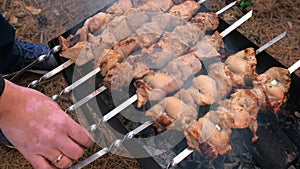 Man barbecuing on the grill, close-up. Barbecue outdoors