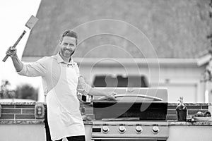 man barbecuing trout fillet on grill, copy space. man barbecuing trout fillet. man barbecuing trout fillet outdoor. man photo