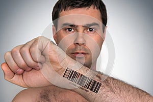 Man with barcode on his hand - genetic clone concept