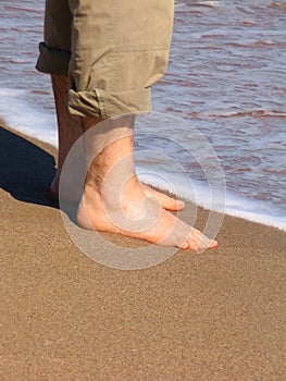 Man barefood on the beach