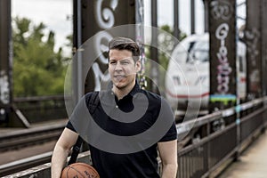 Man With a Basketball and Oncoming Train