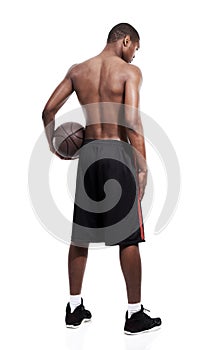 Man, basketball player and standing for workout, back and shirtless on white background, confident and game. Studio