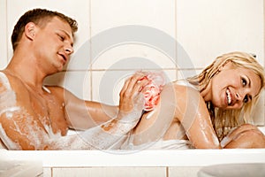 Man bathing his wife