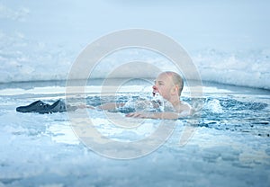 Man bathing in ice cold water