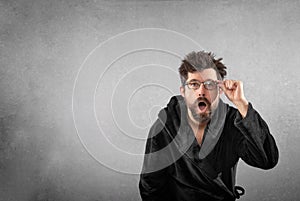 Man in bathrobe with funny hair funny face isolated background