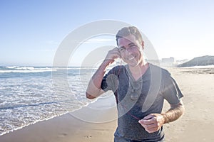 Man on Beach with Earphones