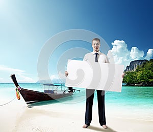 Man on the beach whith empty board in hand