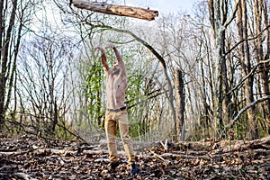 Man beaded brutal lumberjack toss big heavy log. Masculine leisure. Lumberjack or woodman naked muscular torso