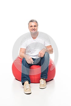 Man on bean bag chair