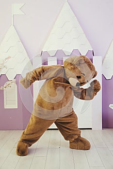 man in a bear costume, holiday entertainment