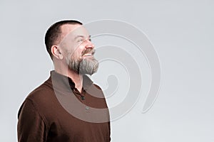 Man with beard amazed and surprised looking up