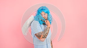 man with beard and blue peruke acts like an agel with wings