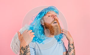 man with beard and blue peruke acts like an agel with wings