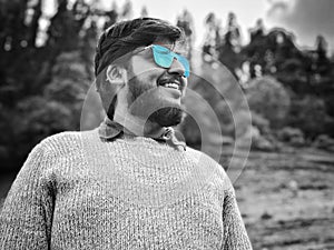 Man with beard and blue shaded sunglasses photo