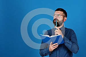Man with beard and book. Idea and knowledge concept