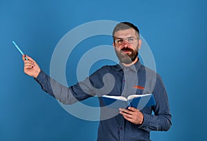 Man with beard and book. Knowledge and lesson concept