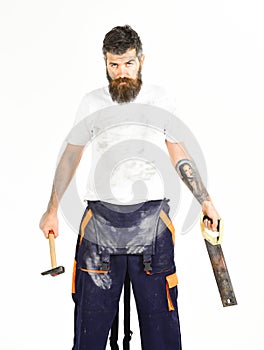 Man with beard in dirty dusty boilersuit. Builder, plasterer, repairman
