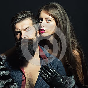 Man with beard and girl in gloves