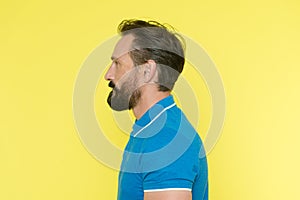 Man with beard has proper posture. Sporty lifestyle and proper nutrition helps to keep youth even at mature age. Healthy