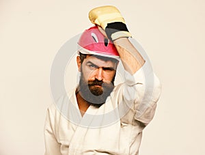 Man with beard in kimono and pink helmet on white